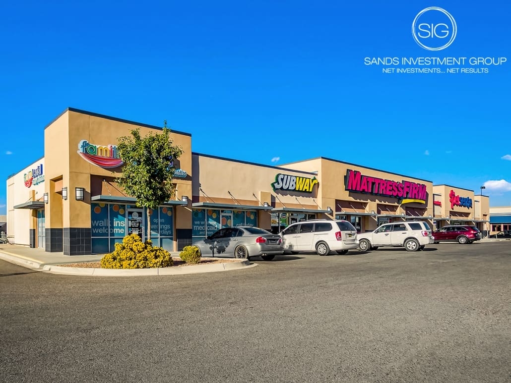 A parking lot with several different stores on it.
