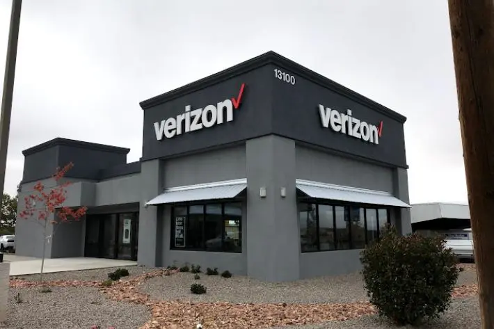Verizon (1) A verizon store with the company logo on it.